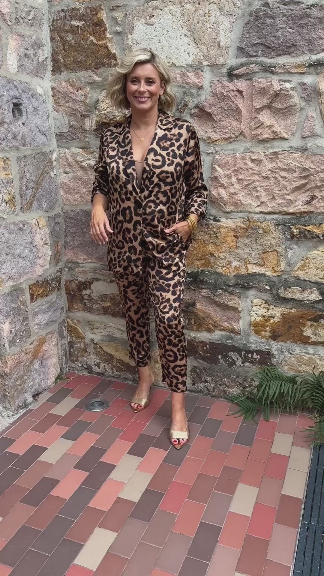 Video of a model wearing a leopard print blazer